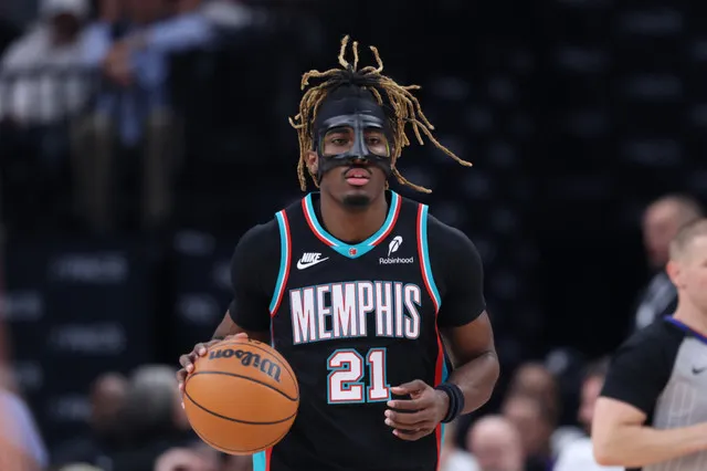 Memphis Grizzlies guard Dariq Whitehead #21 wearing a black protective face mask while dribbling during the Memphis Grizzlies vs Utah Jazz match