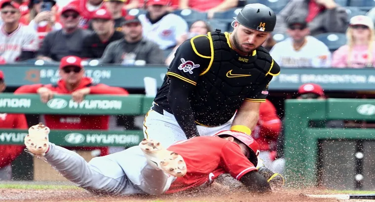 Pittsburgh Pirates vs Cincinnati Reds Match Player Stats (May 3rd, 2026) 3 Pittsburgh Pirates catcher Joey Bart (No. 14) tagging out a sliding Cincinnati Reds baserunner at home plate during the May 3, 2026 MLB game at PNC Park