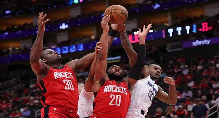 Houston Rockets players contest a shot against Memphis Grizzlies players during an NBA game