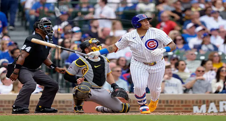 Chicago Cubs batter Miguel Ballesteros hitting a home run at Wrigley Field against the Pittsburgh Pirates on April 12 2026 with Pirates catcher and umpire in frame