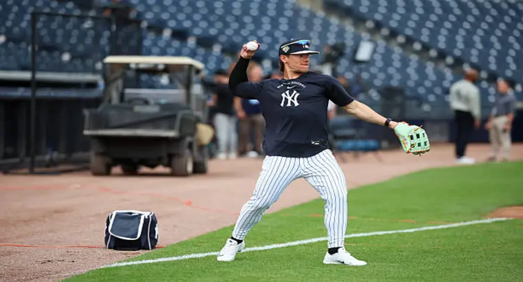 New York Yankees player practicing a throw during pregame warmup against Atlanta Braves on March 13, 2026