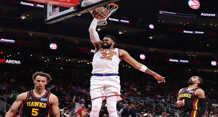 Karl-Anthony Towns #32 of the New York Knicks throws down a dunk against the Atlanta Hawks at State Farm Arena on April 6, 2026