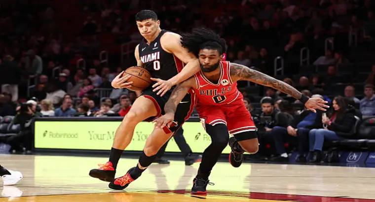 Miami Heat player driving to the basket against Chicago Bulls defender during February 2026 NBA game