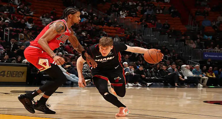 Miami Heat guard Pelle Larsson driving past Chicago Bulls forward during NBA game on February 1 2026 at Kaseya Center